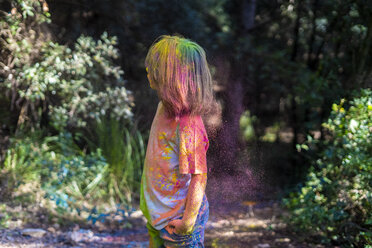 Boy full of colorful powder paint, celebrating Holi, Festival of Colors - ERRF00495