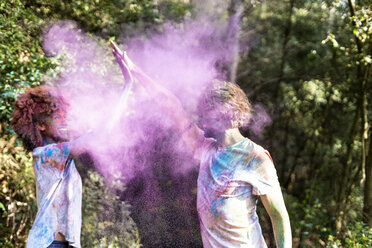 Happy couple celebrating Holi festival. Festival of colors - ERRF00523