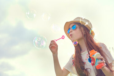 Girl playing with soap bubbles - CUF46785