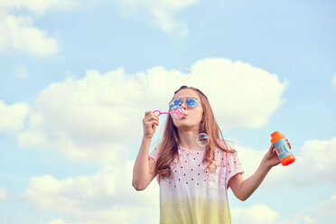 Girl playing with soap bubbles - CUF46788