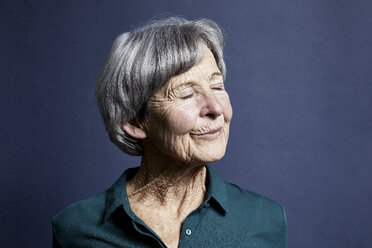 Portrait of smiling senior woman with eyes closed - RBF06997