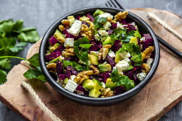 Bowl of beetroot salad with avocado, feta, walnuts and parsley - SARF04054