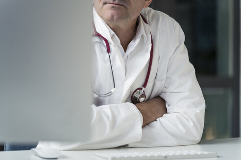 Close-up of doctor in medical practice at desk - JOSF02776