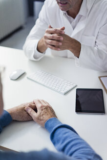 Close-up of doctor talking to senior patient in medical practice - JOSF02804