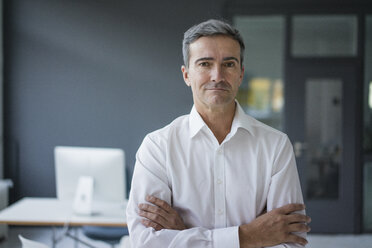 Portrait of confident businessman in the office - JOSF02867