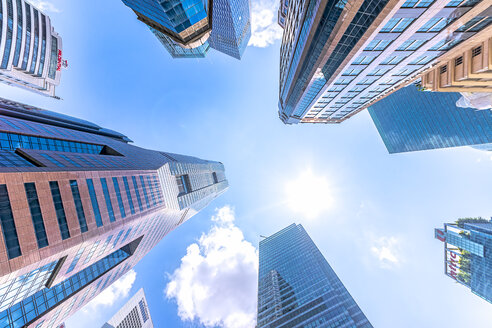 Singapore, High rise buildings, low angle view against the sun - SMAF01211