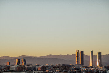 Spain, Madrid, cityscape with modern skyscrapers at twilight - JCMF00038
