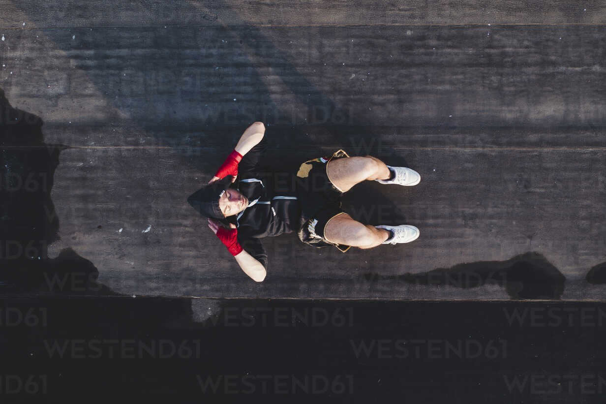 Boxer doing sit ups outdoors stock photo