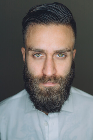 Portrait of young man with beard, close-up stock photo