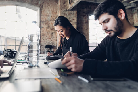 Designers brainstorming in studio stock photo