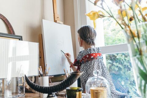 Woman working on designs in her studio stock photo