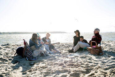 Three generation family enjoying beach - CUF47729