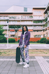 Woman with skateboard, Milan, Italy - CUF48202