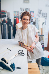 Portrait of fashion designer in her work studio - CUF48273
