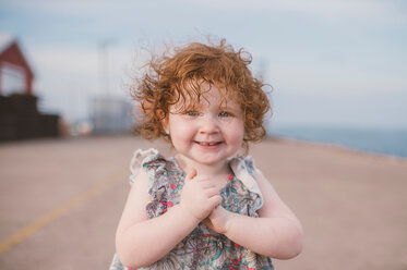 Girl with curly red hair at coast, portrait - ISF20184