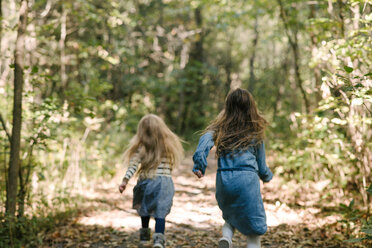 Sisters running in forest - ISF20306
