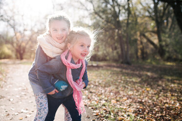 Sisters playing in forest - ISF20312