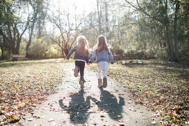 Sisters running in forest - ISF20313