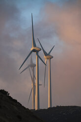 Spain, Andalusia, Tarifa, wind wheels at twilight - KBF00455