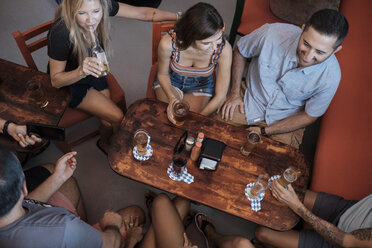 Friends socializing in a bar - ABAF02229