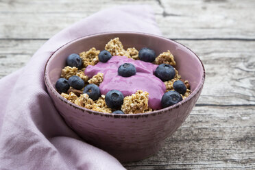 Bowl of Granola with almonds, blueberries and bluebery yoghurt - LVF07665