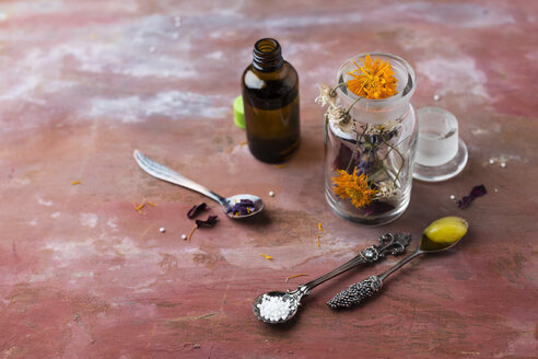 Blossoms of medical plants, medicine flasks, marigold salve and globules - MYF02071