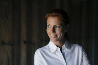 Portrait of smiling businesswoman looking sideways - JOSF03038