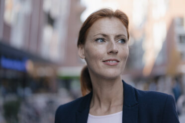 Portrait of businesswoman outdoors in the city - JOSF03040