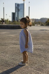 Little girl standing outdoors in summer - MAUF02425