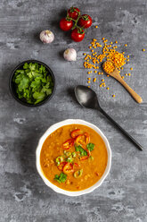 Soup bowl of garnished red lentil soup and ingredients - SARF04062