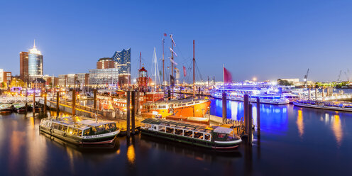 Germany, Hamburg, lighted marina and Niederhafen at twilight - WD05057