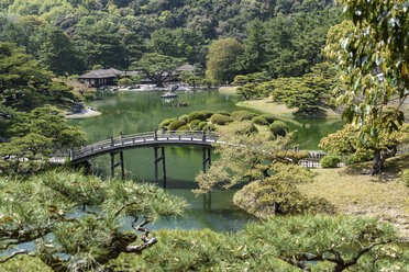 Aerial view of footbridge over ornamental pond, Takamatsu garden, Japan. - MINF10090