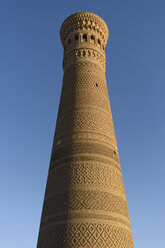 The tall brick built Kalyan minaret at a mosque in Bukhara. - MINF10120