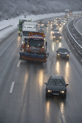 Germany, motorway in winter, icy road and traffic - CRF02828
