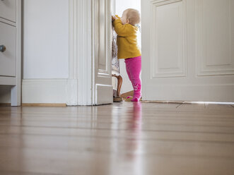 Curious baby girl exploring home - LAF02225