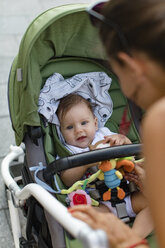 Mother and her baby in a stroller - MOMF00614