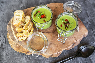 Two glasses of pea soup with fried tofu, red chili pepper and spring onions - SARF04088