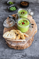 Two glasses of pea soup with fried tofu, red chili pepper and spring onions - SARF04089