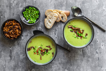 Bowls of pea soup with fried tofu, red chili pepper and spring onions - SARF04091