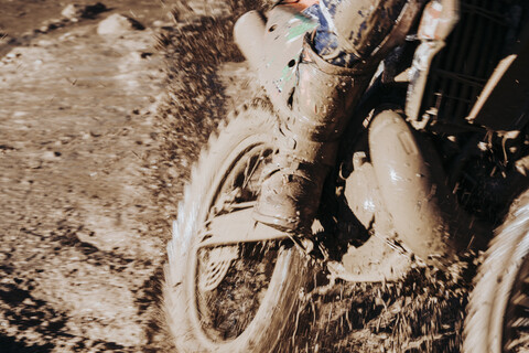 Close-up motocross wheel with water and mud stock photo