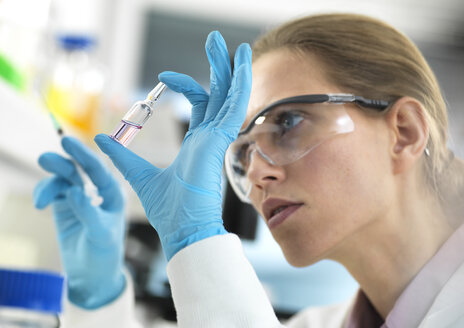 Pharmaceutical Research, Scientist preparing a new drug for testing in the laboratory - ABRF00317