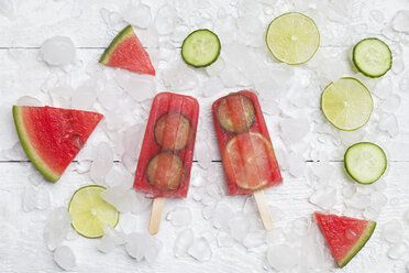 Homemade watermelon cucumber ice lollies on white ground - GWF05842