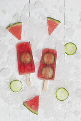 Homemade watermelon cucumber ice lollies on white ground - GWF05843