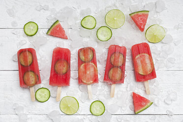 Homemade watermelon cucumber ice lollies on white ground - GWF05844