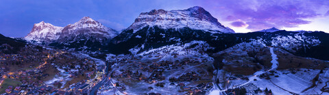 Switzerland, Canton of Bern, Wetterhorn, Grindelwald, townscape at blue hour in winter stock photo