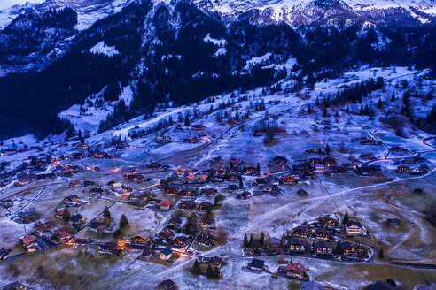 Switzerland, Canton of Bern, Wetterhorn, Grindelwald, townscape at blue hour in winter - AMF06762