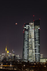 Germany, Frankfurt on Main, view to European Central Bank and lighted city skyline at total lunar eclipse - THGF00079