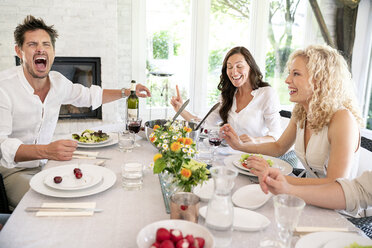 Excited man screaming on a family celebration - PESF01276