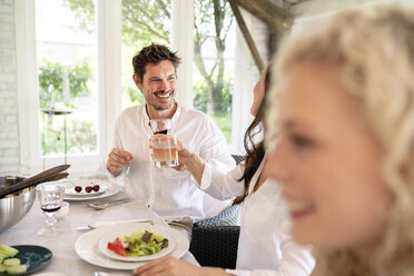 Happy family having meal together - PESF01285