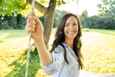 Portrait of happy mature woman in garden - PESF01341